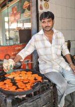 street-vendor-india-preparing-sweets-sweet-shop-71366961.jpg